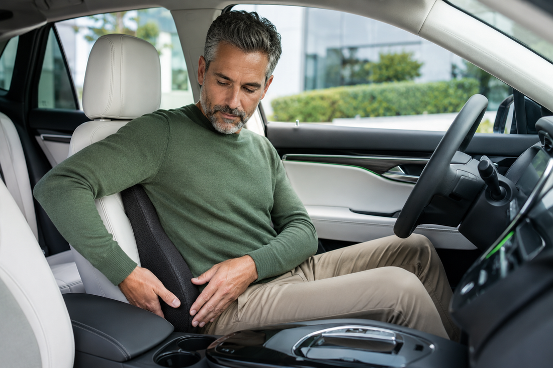 Driver adjusting a lumbar support cushion in a parked car