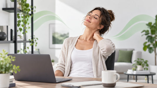 Woman relaxing her neck after desk work in a clean wellness setting