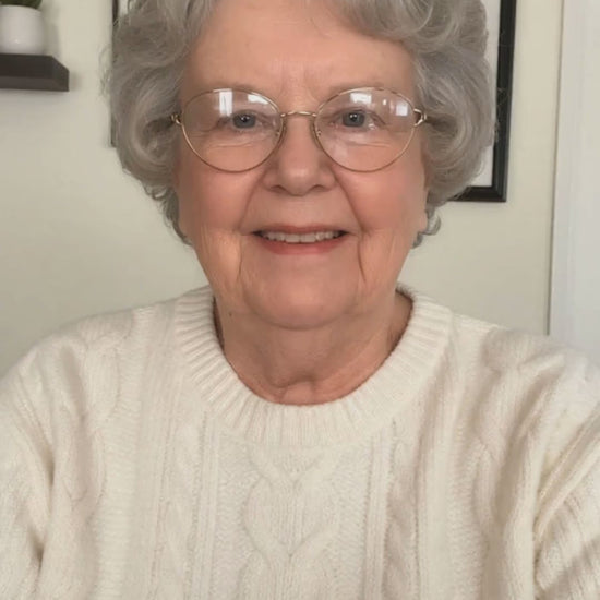 Woman using the Spinevo™ Smart Neck Relief Massager for everyday neck comfort and relaxation.